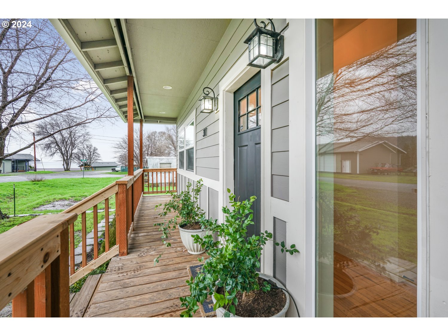 311 Washington Street Lyle, WA 98635 - Photo 4 of 29 a view of a porch with wooden floor and outdoor space