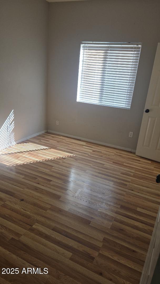 854 South Comanche Court Chandler, AZ 85224 - Photo 2 of 6 a view of empty room with wooden floor