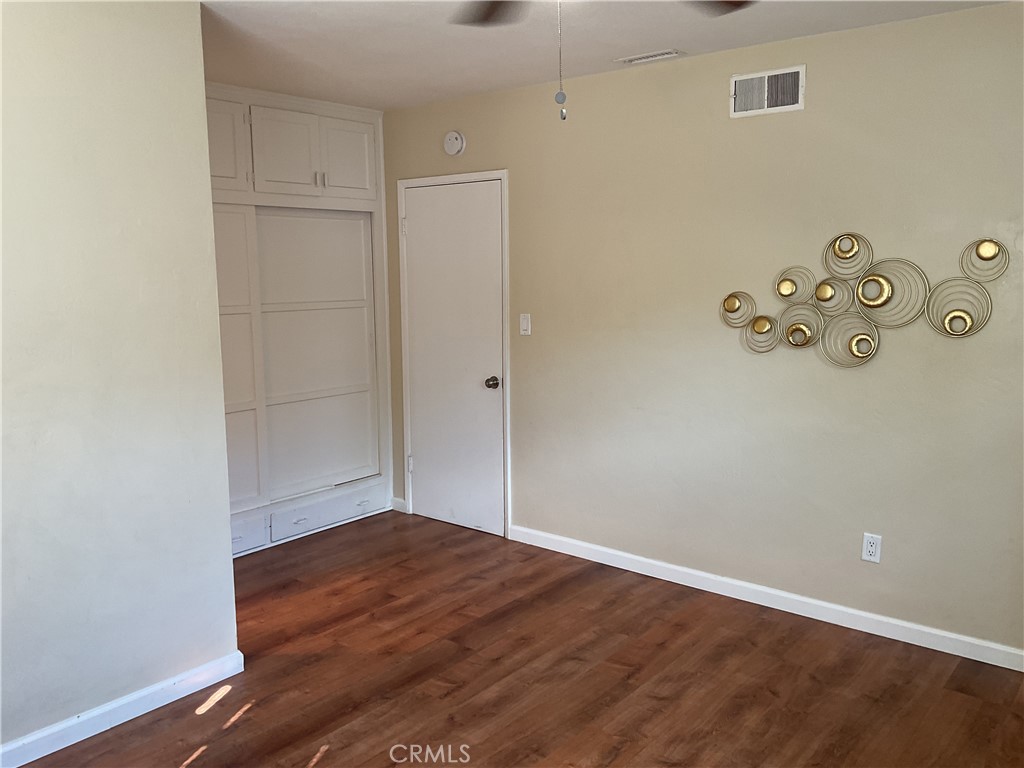 7570 Delaware Street Riverside, CA 92504 - Photo 17 of 21 an empty room with wooden floor