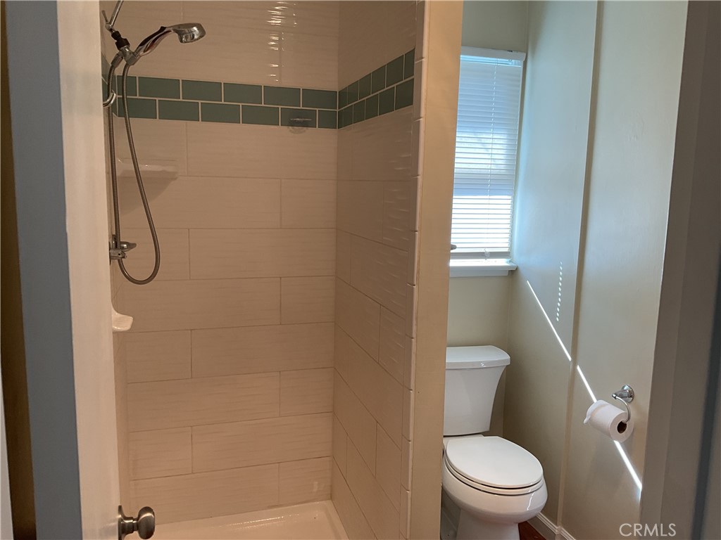 7570 Delaware Street Riverside, CA 92504 - Photo 19 of 21 a bathroom with a toilet and shower
