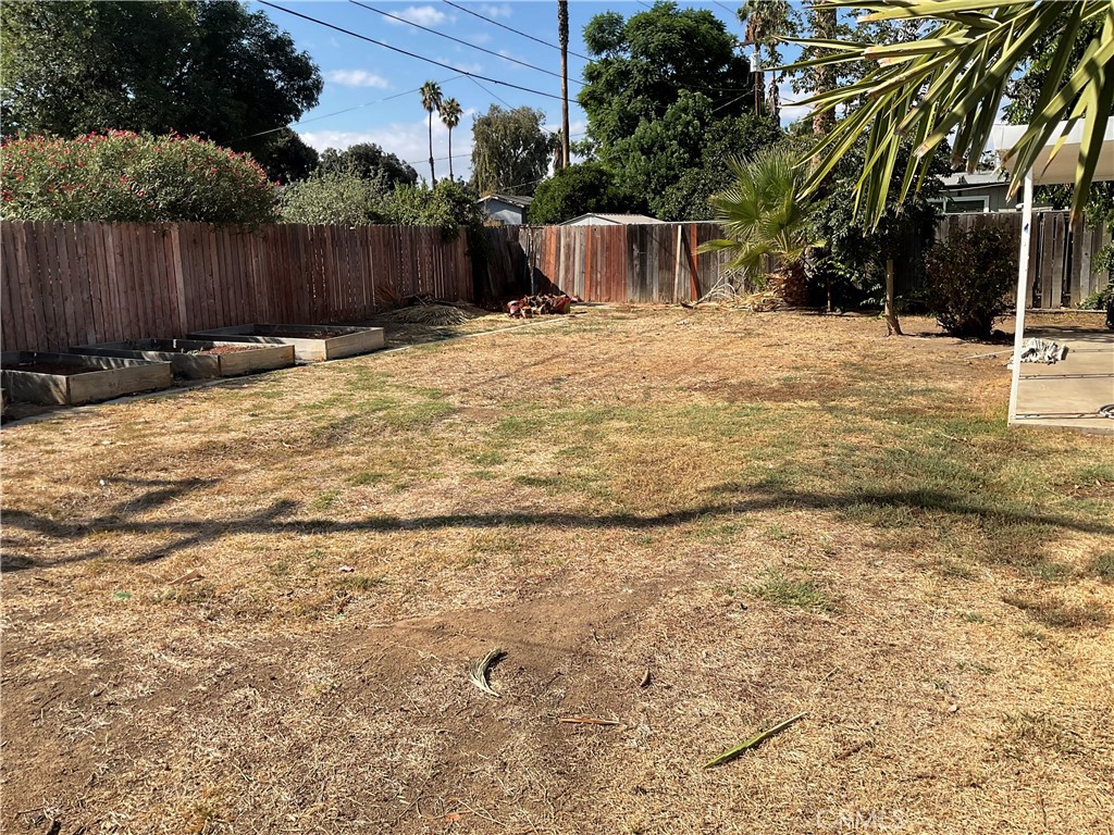 7570 Delaware Street Riverside, CA 92504 - Photo 21 of 21 a view of backyard with wooden fence