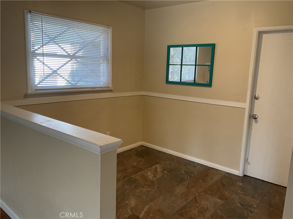 7570 Delaware Street Riverside, CA 92504 - Photo 6 of 21 an empty room with windows and closet