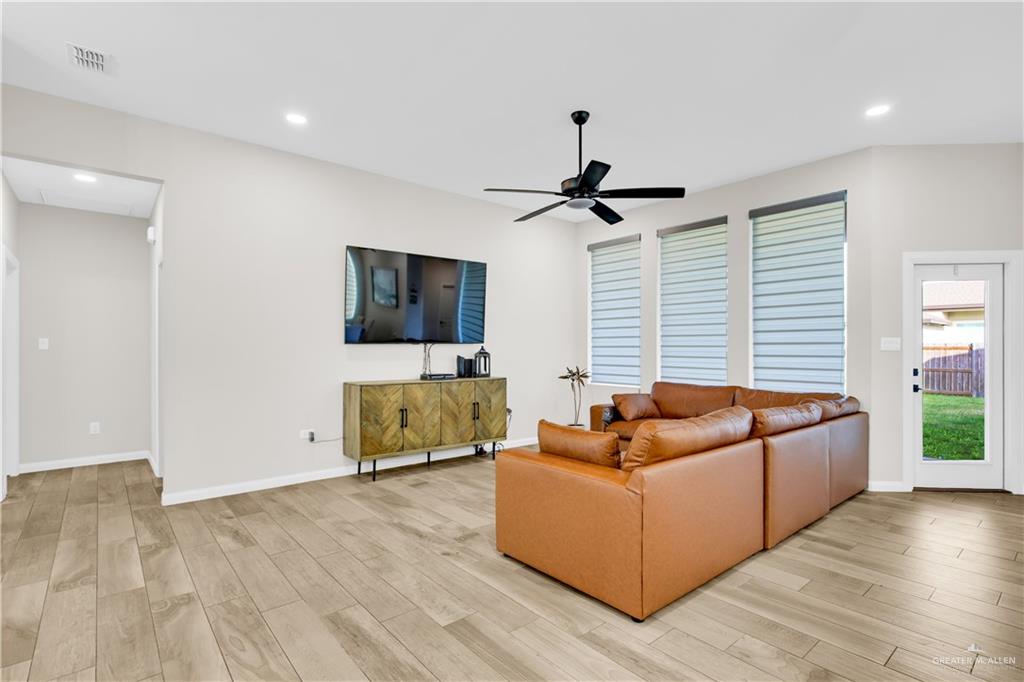 2514 Yarrow Street Mission, TX 78574 - Photo 3 of 22 Living area with light wood finished floors, a ceiling fan, and recessed lighting