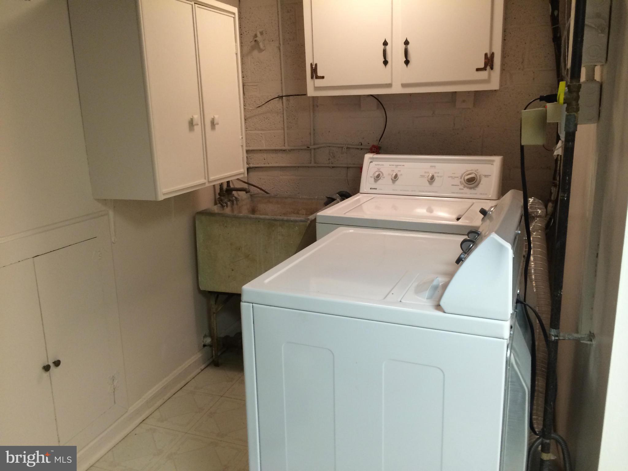 3530 Olympic Street Silver Spring, MD 20906 - Photo 19 of 27 LAUNDRY ROOM WITH STORAGE CABINETS