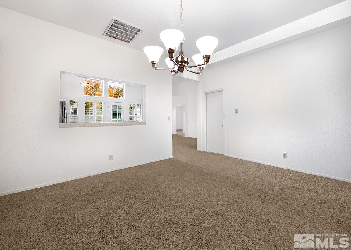6209 Alpine Meadows Road Reno, NV 89519 - Photo 11 of 23 a view of livingroom with chandelier fan