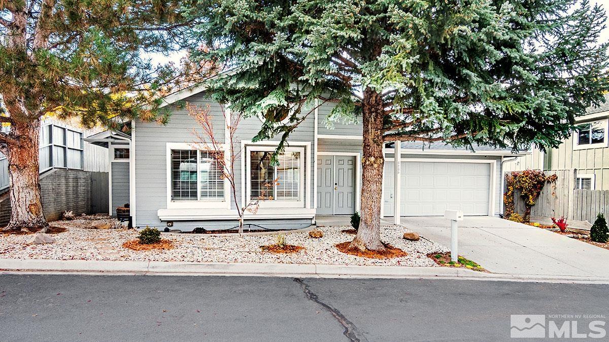 6209 Alpine Meadows Road Reno, NV 89519 - Photo 2 of 23 a front view of a house with a tree
