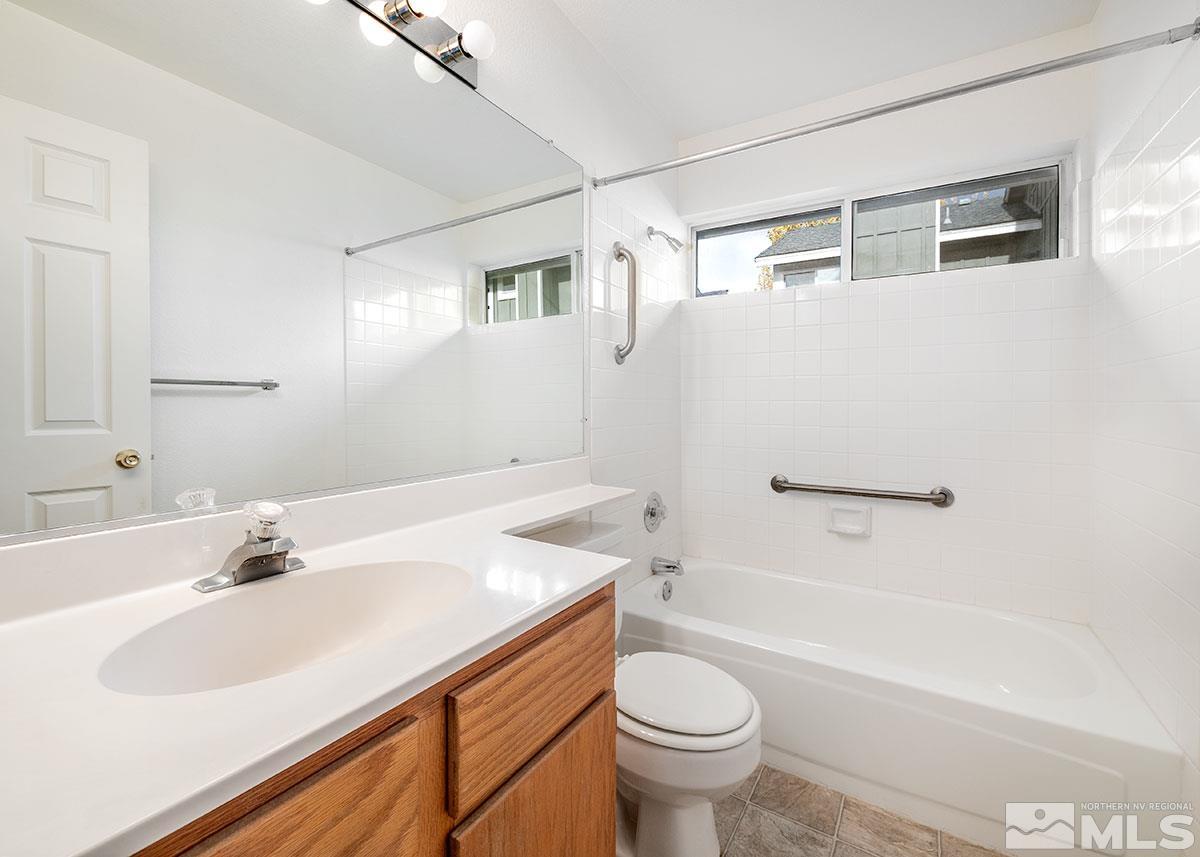 6209 Alpine Meadows Road Reno, NV 89519 - Photo 22 of 23 a bathroom with a sink a toilet and a bathtub