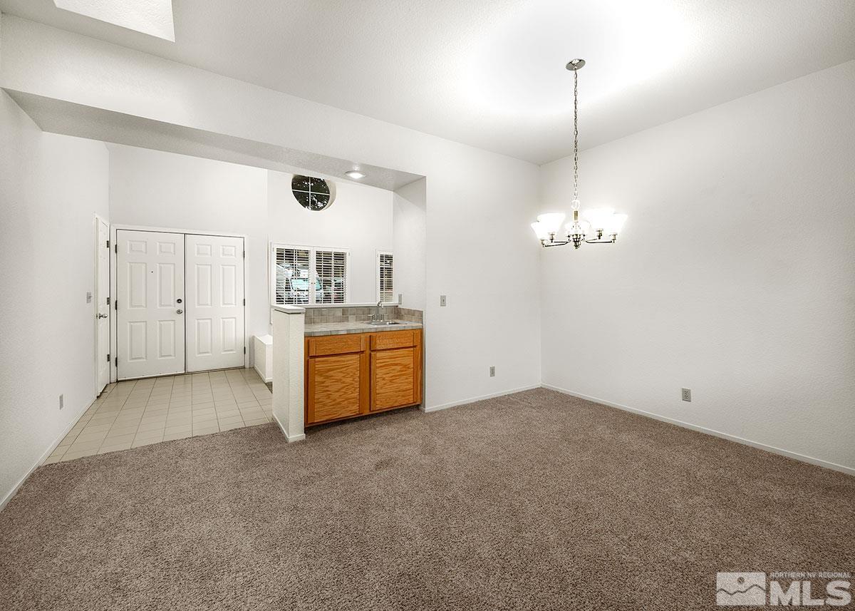 6209 Alpine Meadows Road Reno, NV 89519 - Photo 10 of 23 a view of a room with a kitchen and a sink