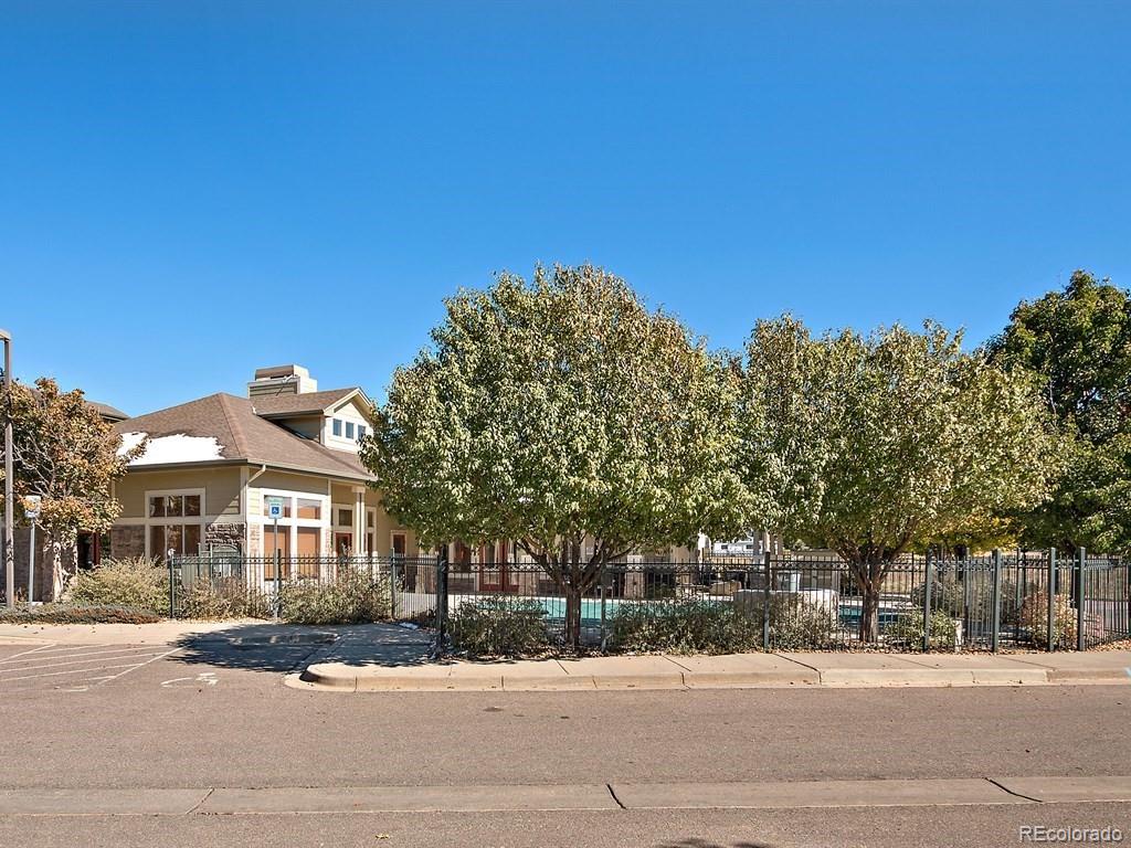 5800 Tower Road, Unit 908 Denver, CO 80249 - Photo 19 of 25 a front view of a house with a yard