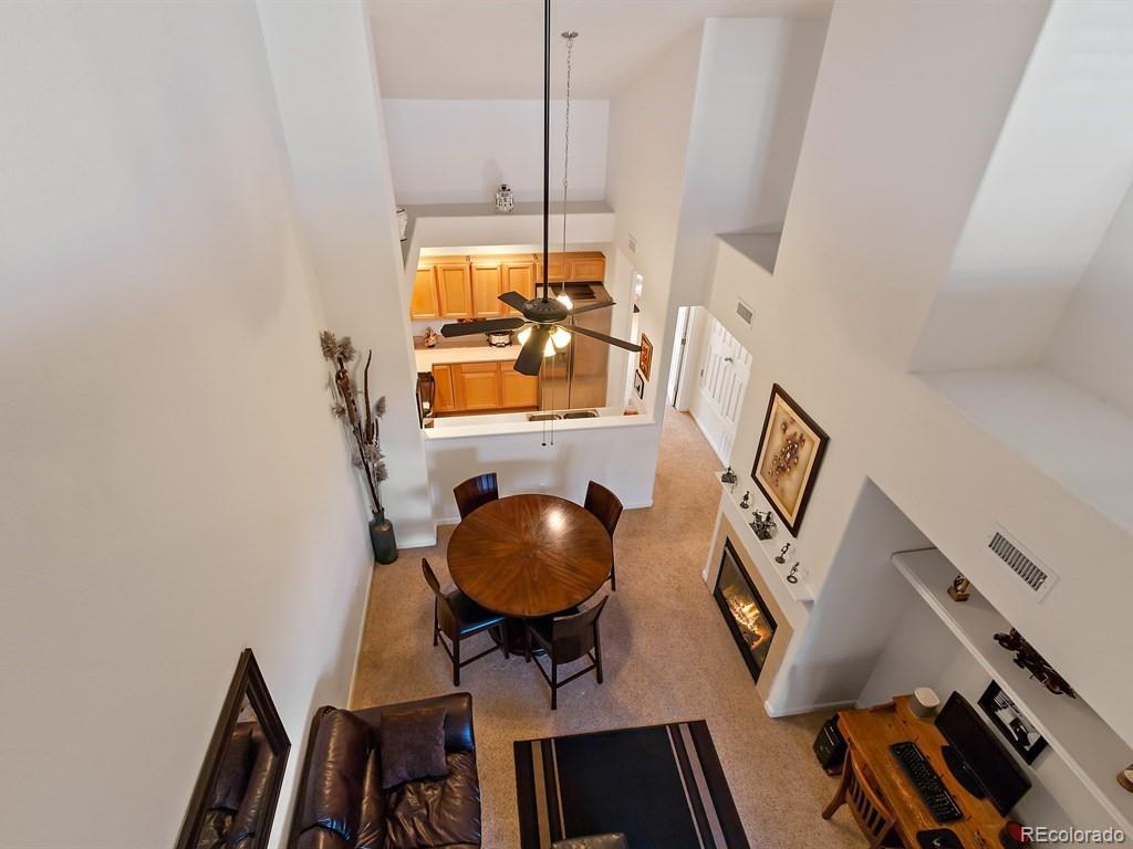 5800 Tower Road, Unit 908 Denver, CO 80249 - Photo 2 of 25 a view of workspace and wooden floor