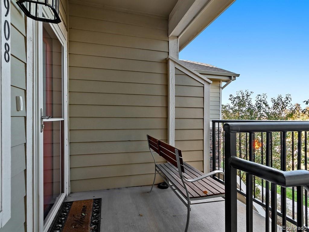 5800 Tower Road, Unit 908 Denver, CO 80249 - Photo 21 of 25 a view of a door and chair in the balcony