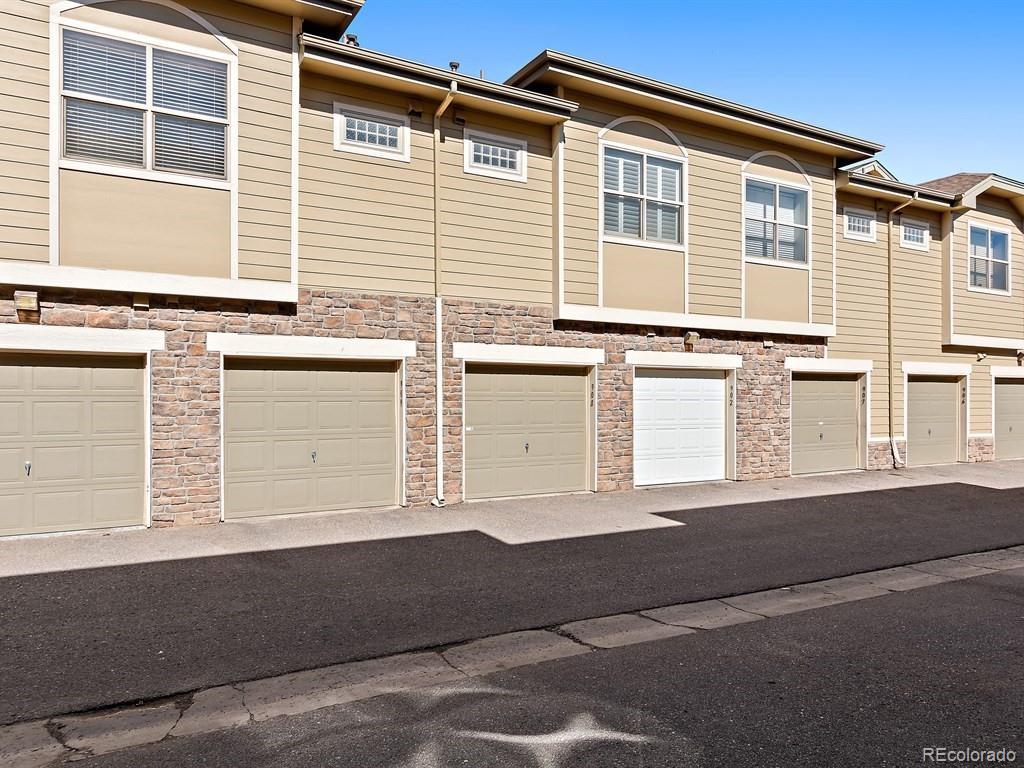 5800 Tower Road, Unit 908 Denver, CO 80249 - Photo 22 of 25 a front view of a house with a garage