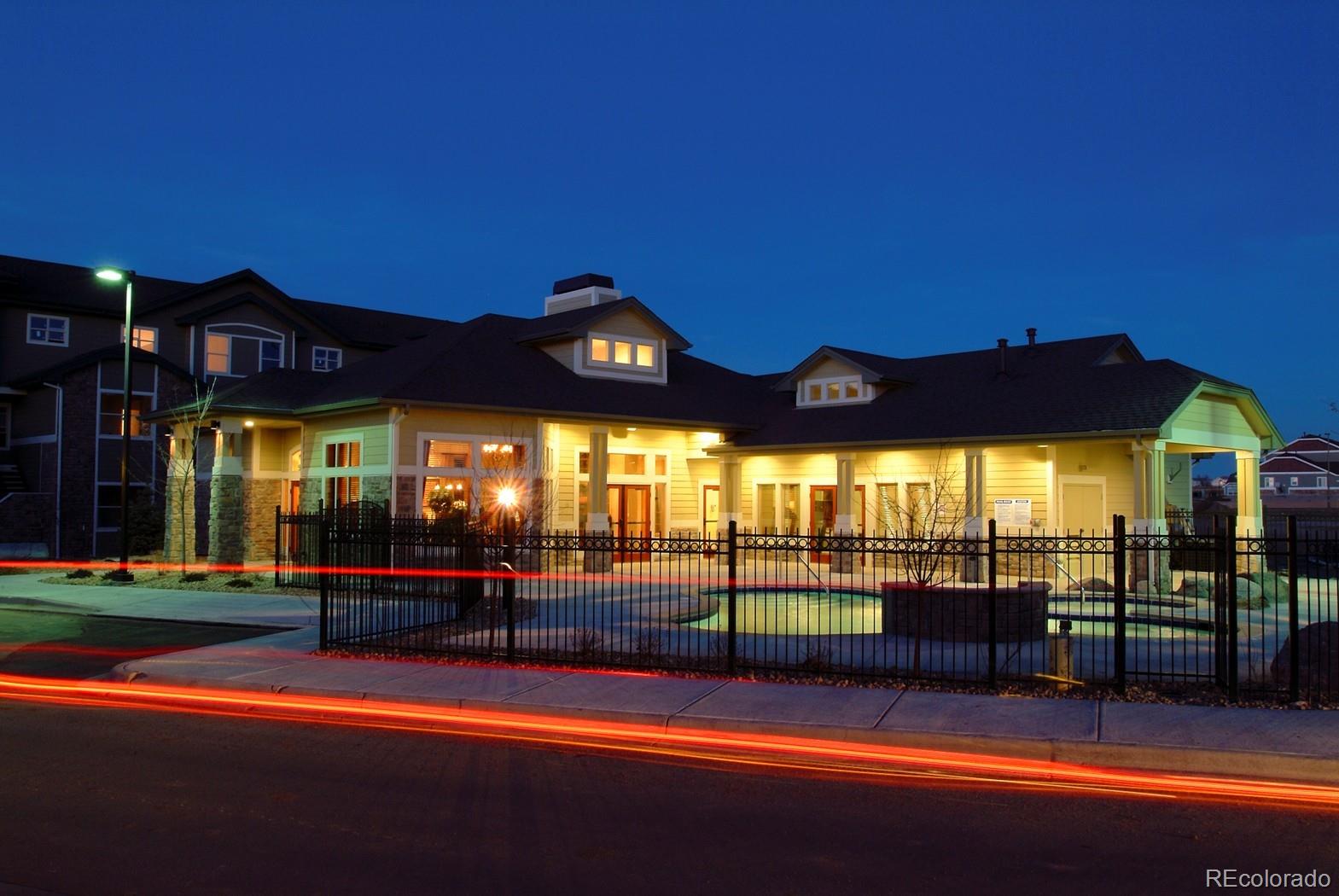 5800 Tower Road, Unit 908 Denver, CO 80249 - Photo 23 of 25 a view of a building with a swimming pool