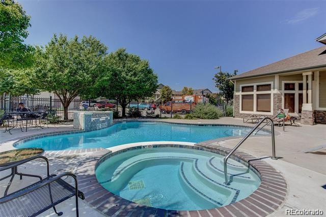 5800 Tower Road, Unit 908 Denver, CO 80249 - Photo 25 of 25 a swimming pool with outdoor seating and yard