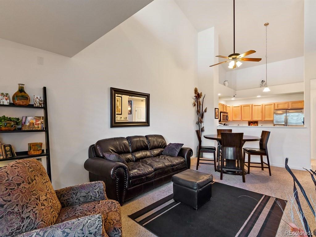 5800 Tower Road, Unit 908 Denver, CO 80249 - Photo 3 of 25 a living room with furniture