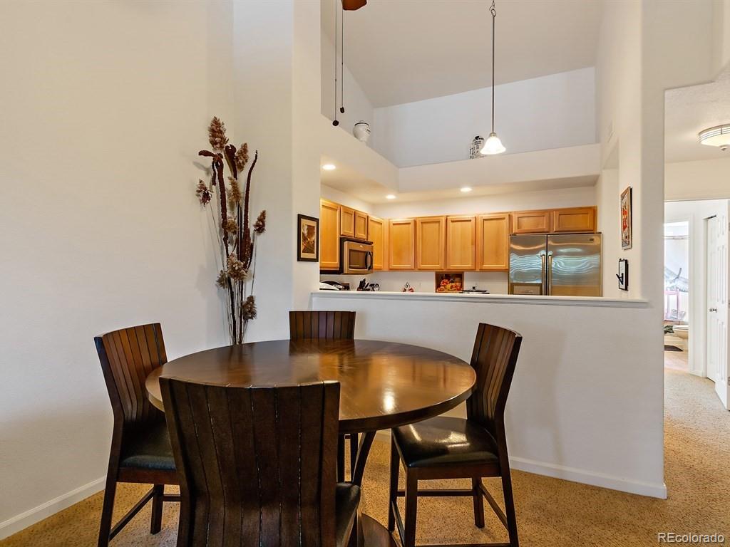 5800 Tower Road, Unit 908 Denver, CO 80249 - Photo 9 of 25 a dining room with furniture and window