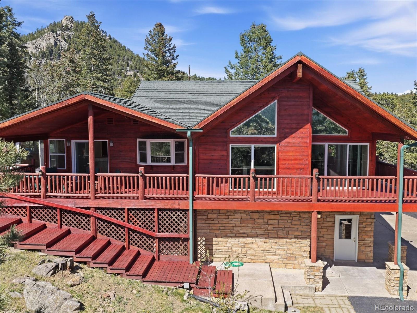 8969 South Hillview Road Morrison, CO 80465 - Photo 4 of 50 a view of a house with a patio