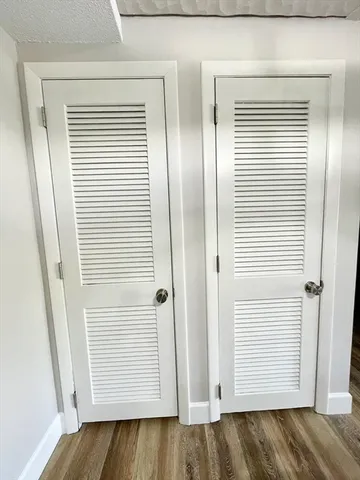 an entryway with wooden floor