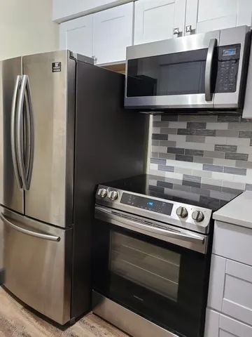 a close view of a stove top oven sitting inside of a kitchen