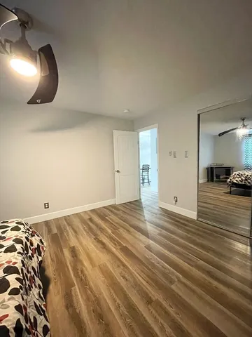 a view of a livingroom with wooden floor