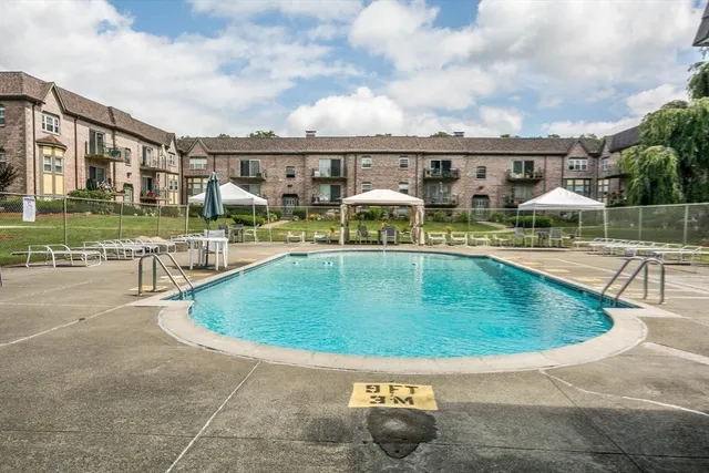 a view of a swimming pool with a patio