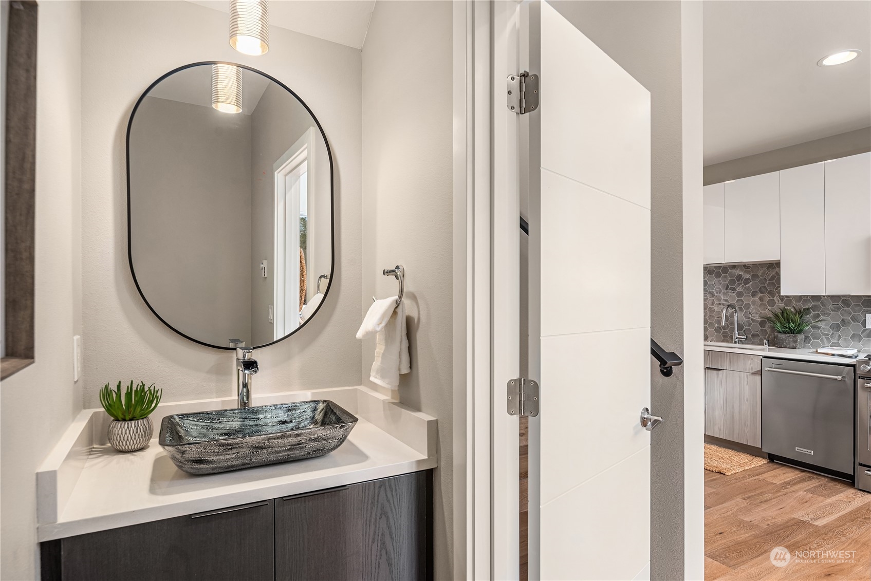 4406 Southwest Holly Street Seattle, WA 98136 - Photo 13 of 32 a bathroom with a sink and a mirror