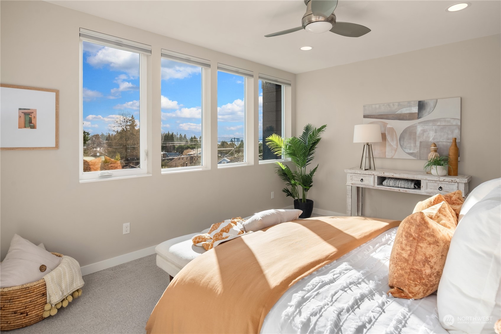 4406 Southwest Holly Street Seattle, WA 98136 - Photo 14 of 32 a bedroom with a large bed and a large window