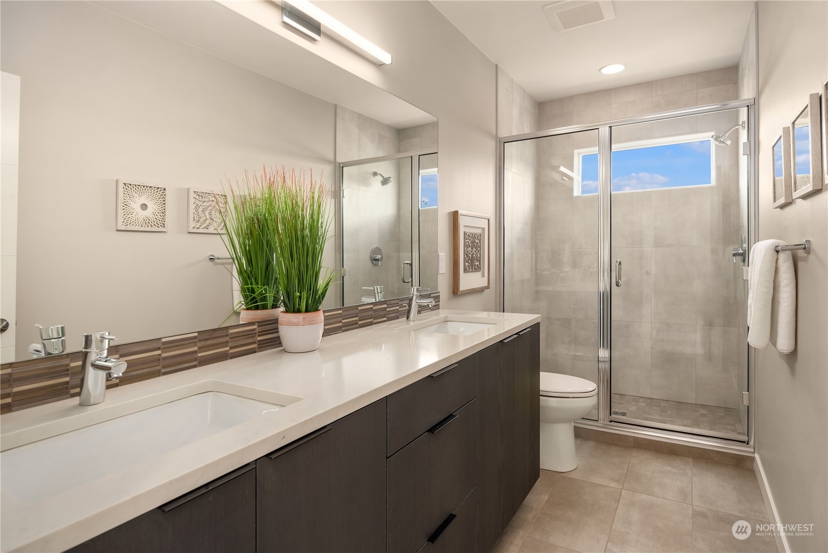 4406 Southwest Holly Street Seattle, WA 98136 - Photo 16 of 32 a bathroom with a double vanity sink and mirror