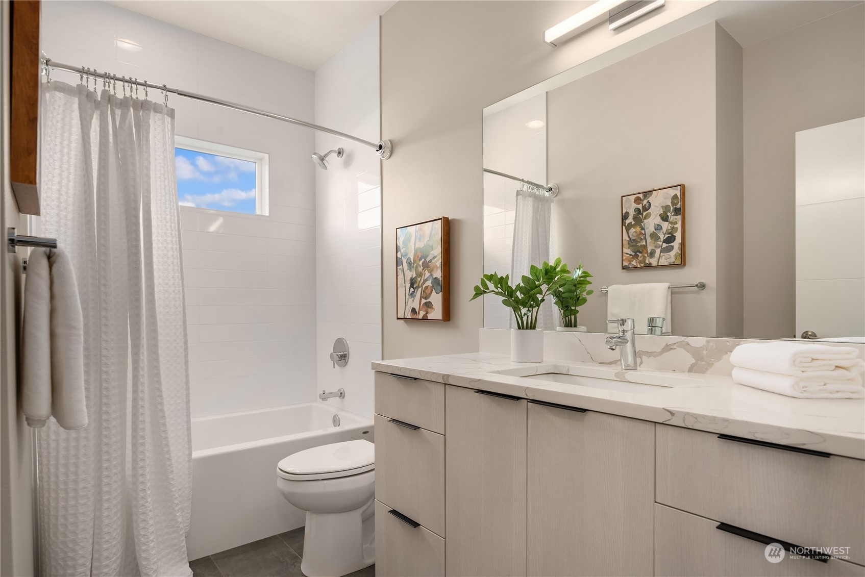 4406 Southwest Holly Street Seattle, WA 98136 - Photo 18 of 32 a bathroom with a granite countertop sink toilet and shower