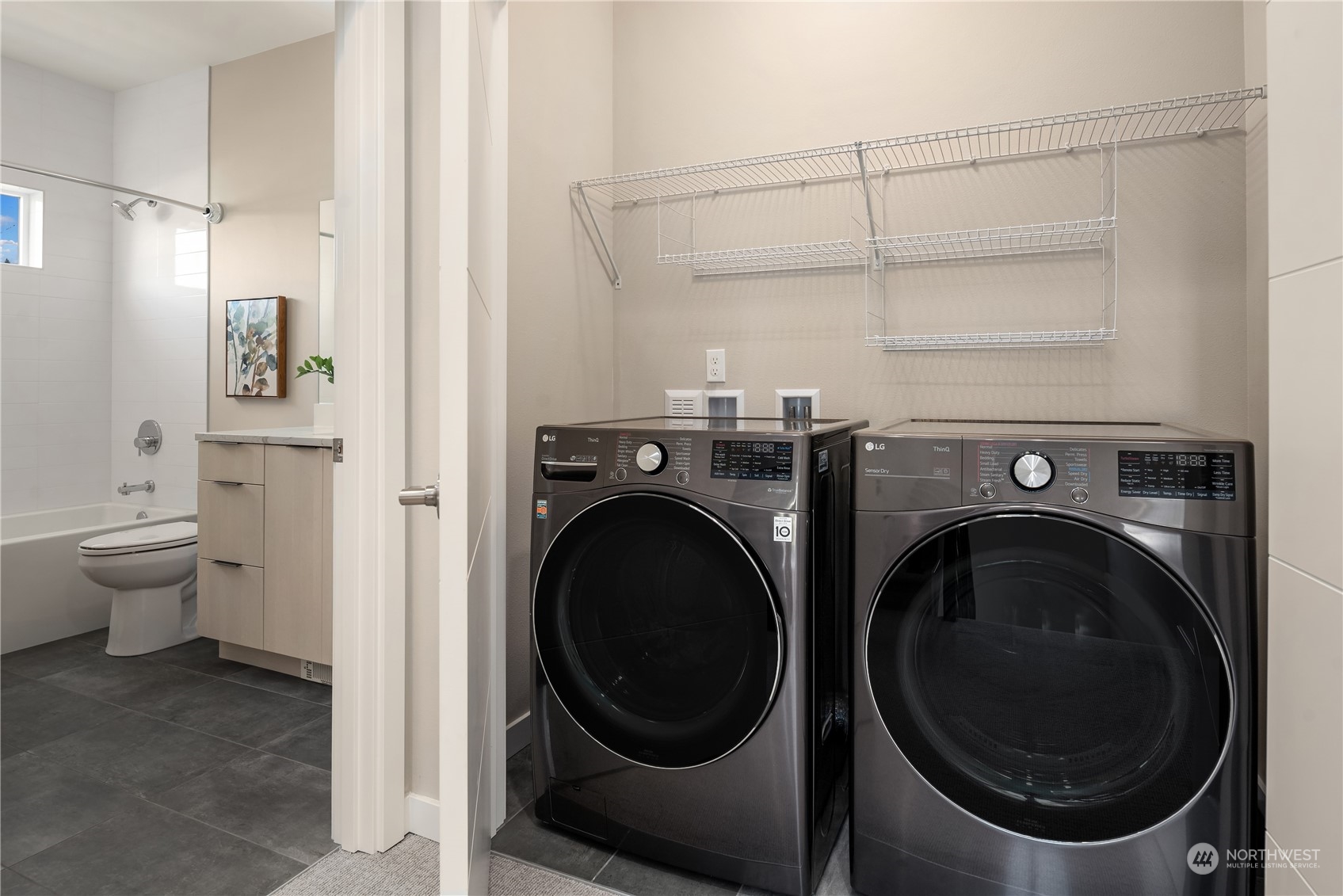 4406 Southwest Holly Street Seattle, WA 98136 - Photo 19 of 32 a view of a hallway with washer and dryer