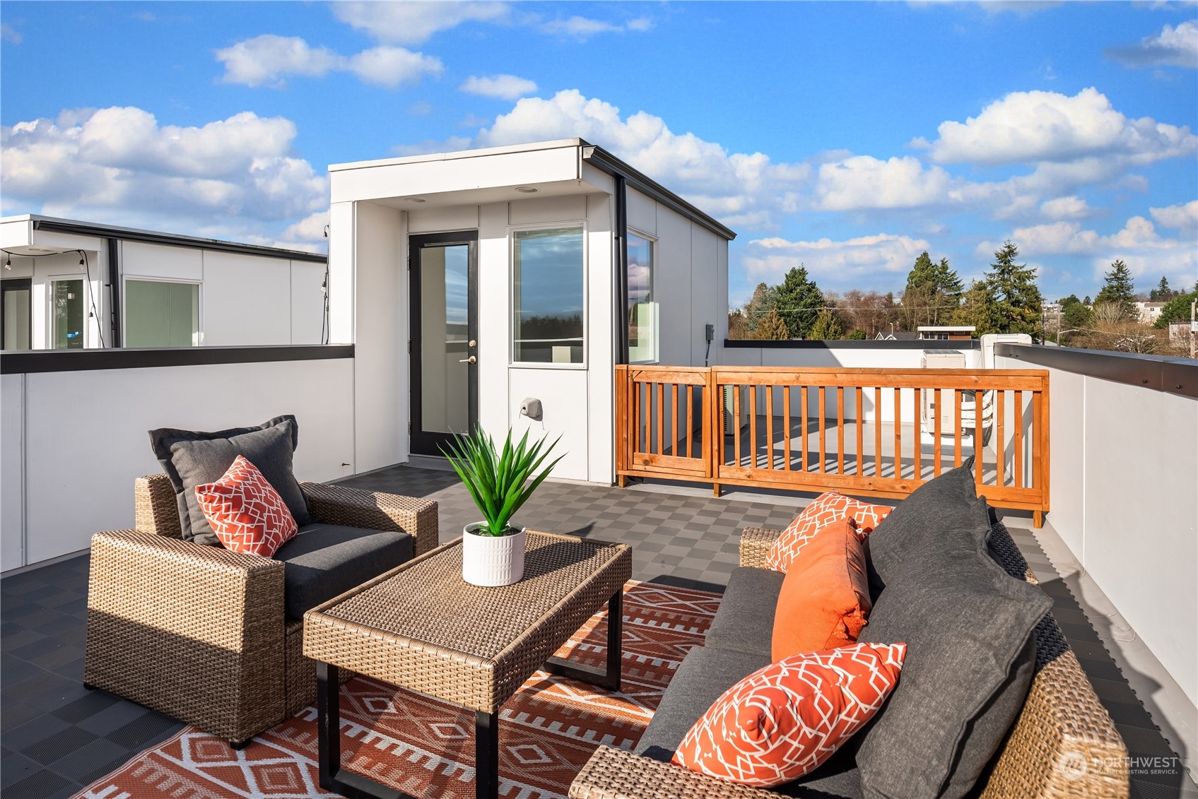 4406 Southwest Holly Street Seattle, WA 98136 - Photo 24 of 32 a roof deck with table and chairs