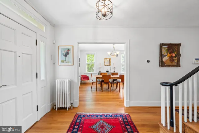 a living room with furniture and a book shelf