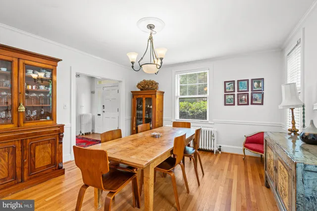a living room with furniture large window and a fireplace