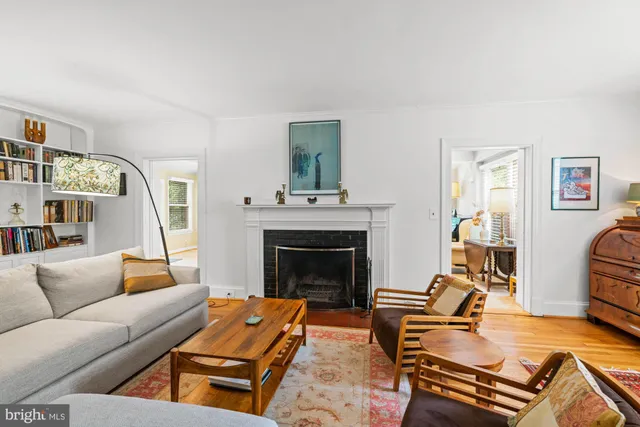 a kitchen with granite countertop stainless steel appliances a refrigerator and a stove top oven