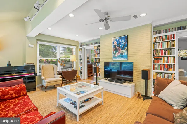 a bedroom with a bed and a book shelf