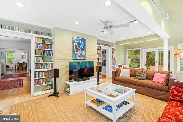 a bathroom with a sink vanity mirror and toilet