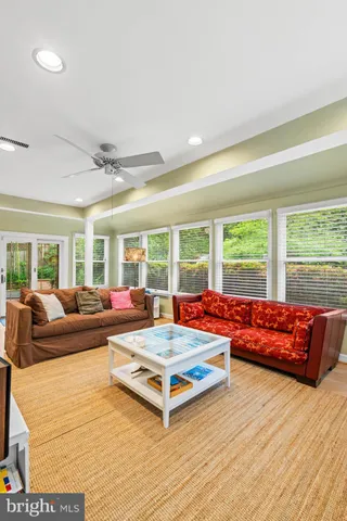a bedroom with a bed and a lamp on dresser