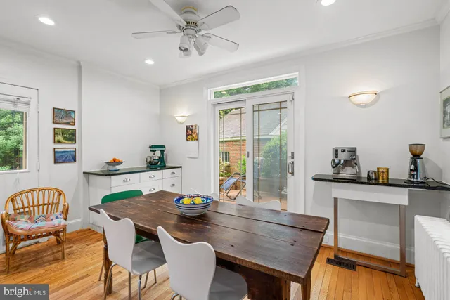 a front view of a house with a yard and fountain