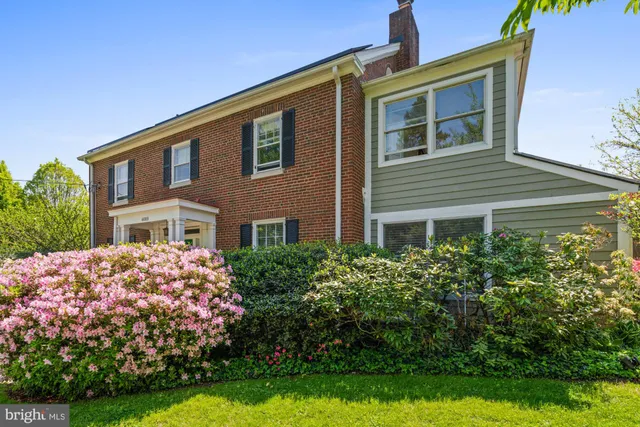 a view of a bedroom with wooden floor and a rug