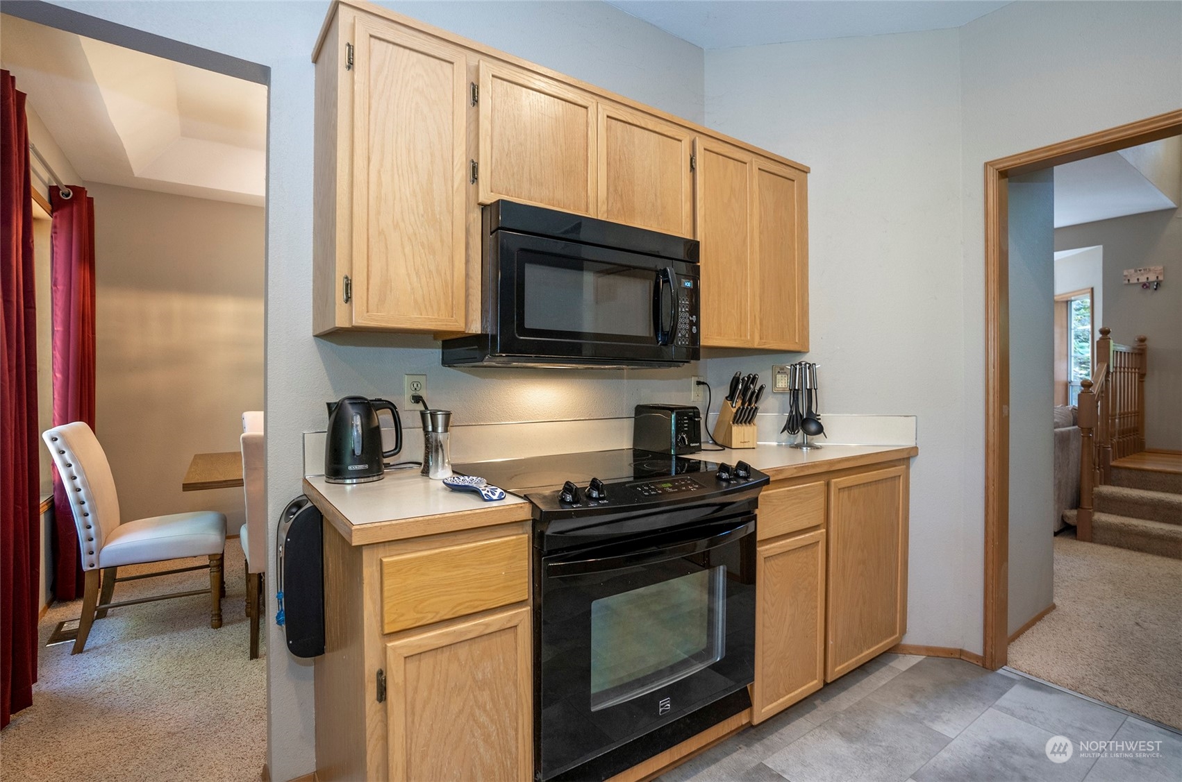 2833 Marietta Street Steilacoom, WA 98388 - Photo 11 of 40 a kitchen with a stove a sink and a microwave