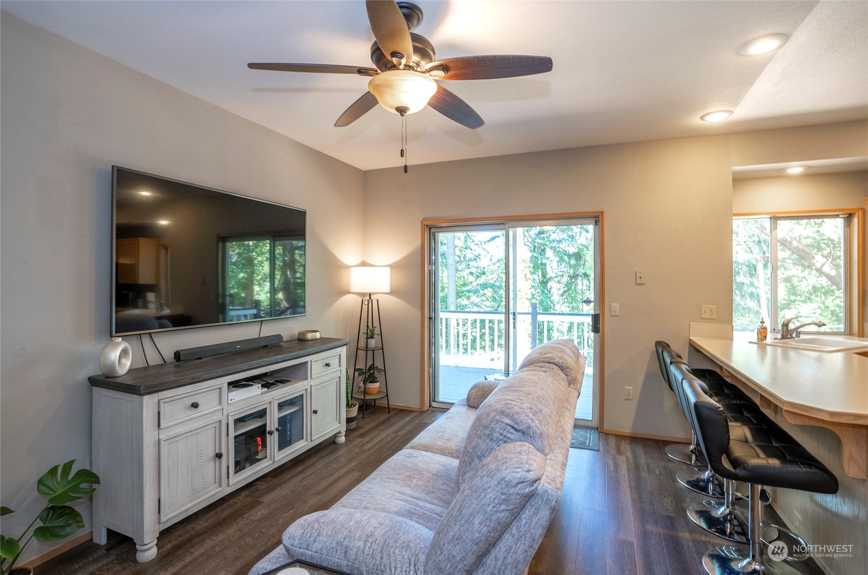 2833 Marietta Street Steilacoom, WA 98388 - Photo 15 of 40 a kitchen with stainless steel appliances granite countertop a stove oven a dining table and chairs with wooden floor