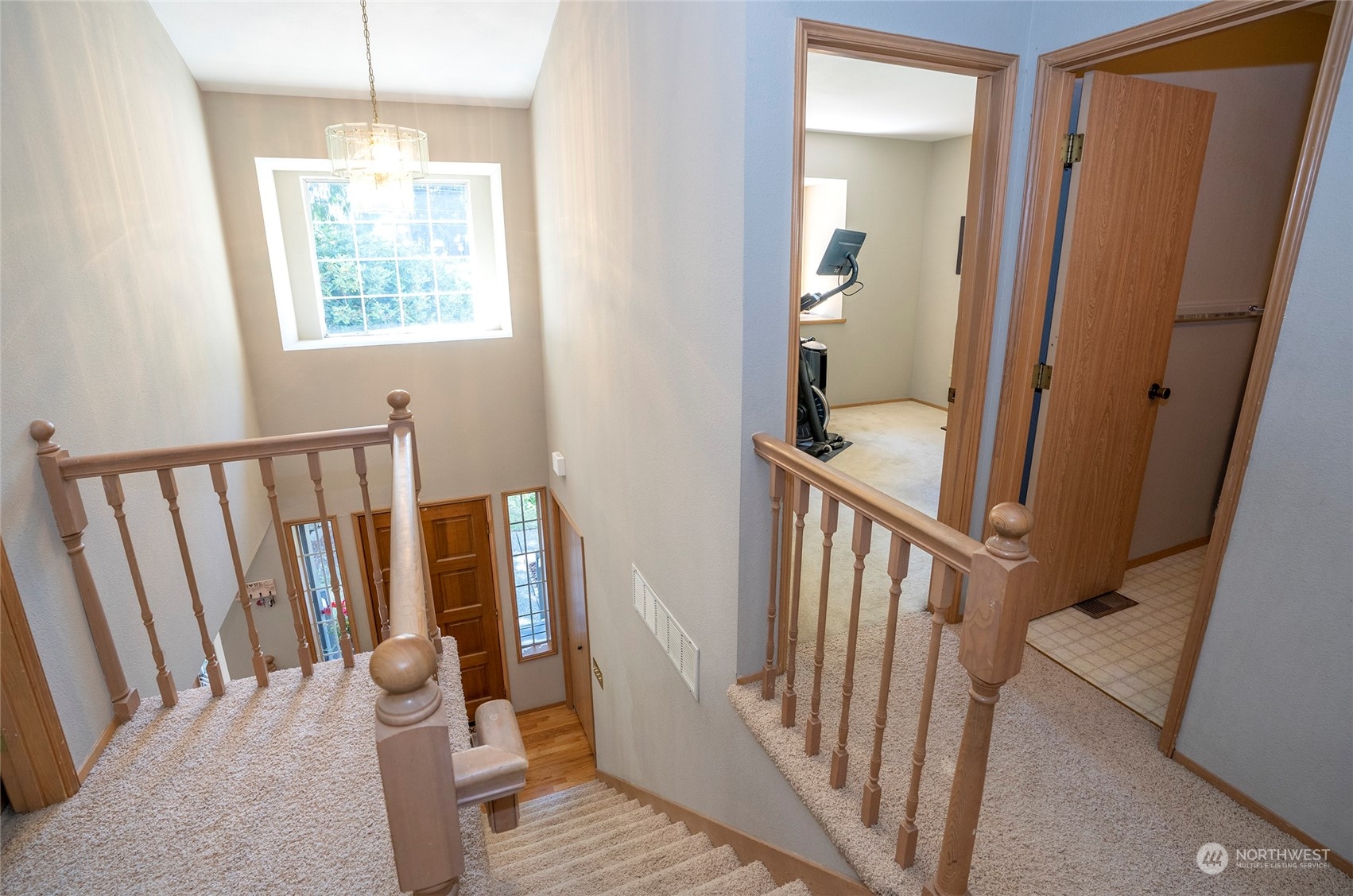 2833 Marietta Street Steilacoom, WA 98388 - Photo 18 of 40 a view of a hallway with wooden floor and stairs