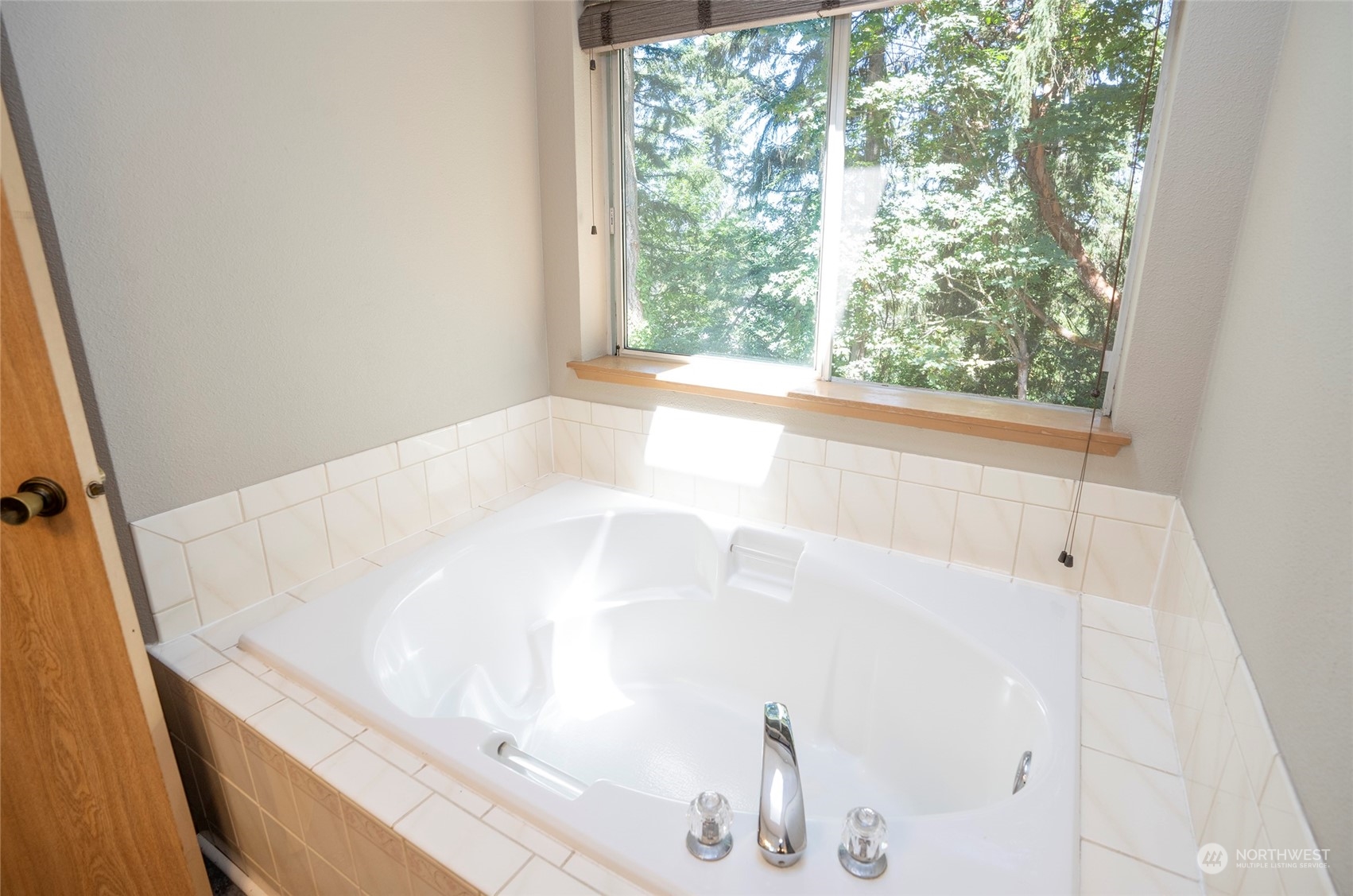 2833 Marietta Street Steilacoom, WA 98388 - Photo 22 of 40 a bath tub sitting in a bathroom next to a window