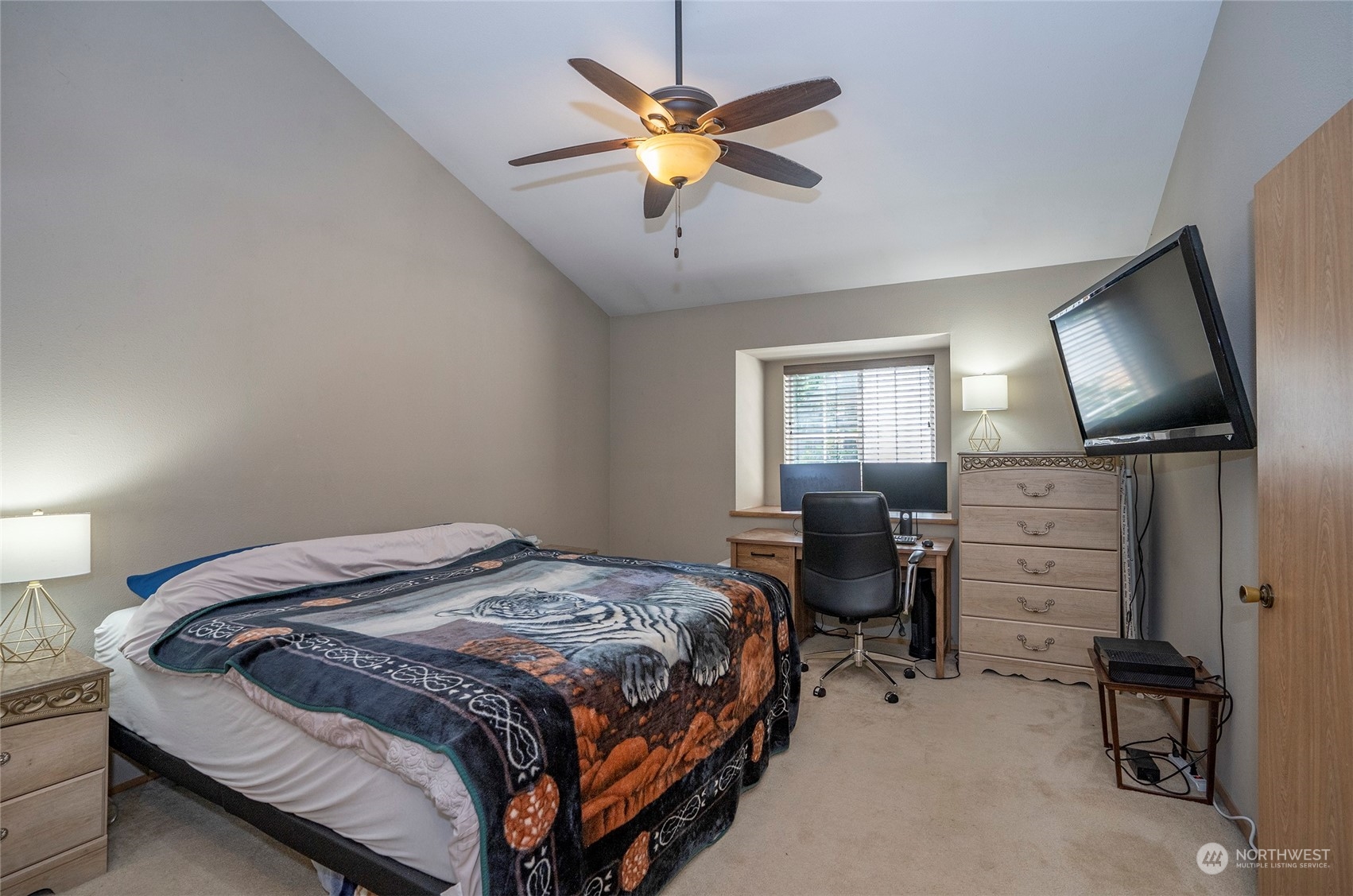 2833 Marietta Street Steilacoom, WA 98388 - Photo 26 of 40 a bedroom with bed tv and chair