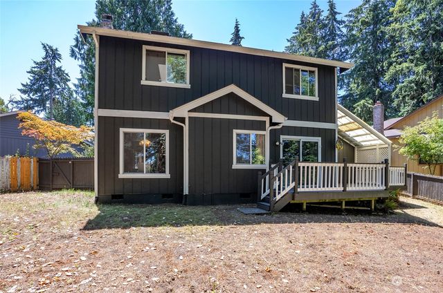 an aerial view of residential house with outdoor space and swimming pool