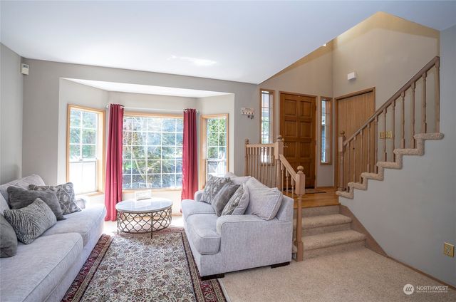 a living room with furniture or couch and a fireplace