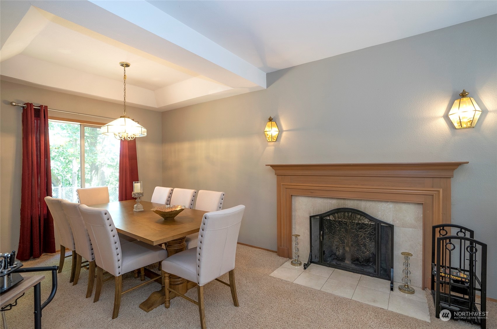 2833 Marietta Street Steilacoom, WA 98388 - Photo 7 of 40 a dining room with furniture a fireplace and a chandelier