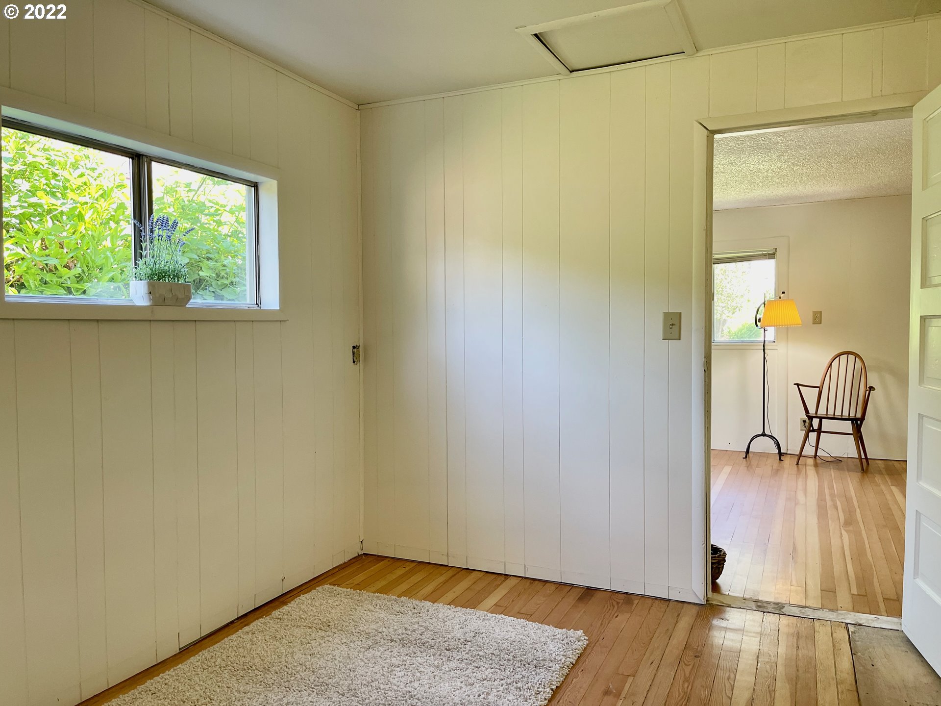 1147 F Street Springfield, OR 97477 - Photo 18 of 32 an empty room with wooden floor and a window