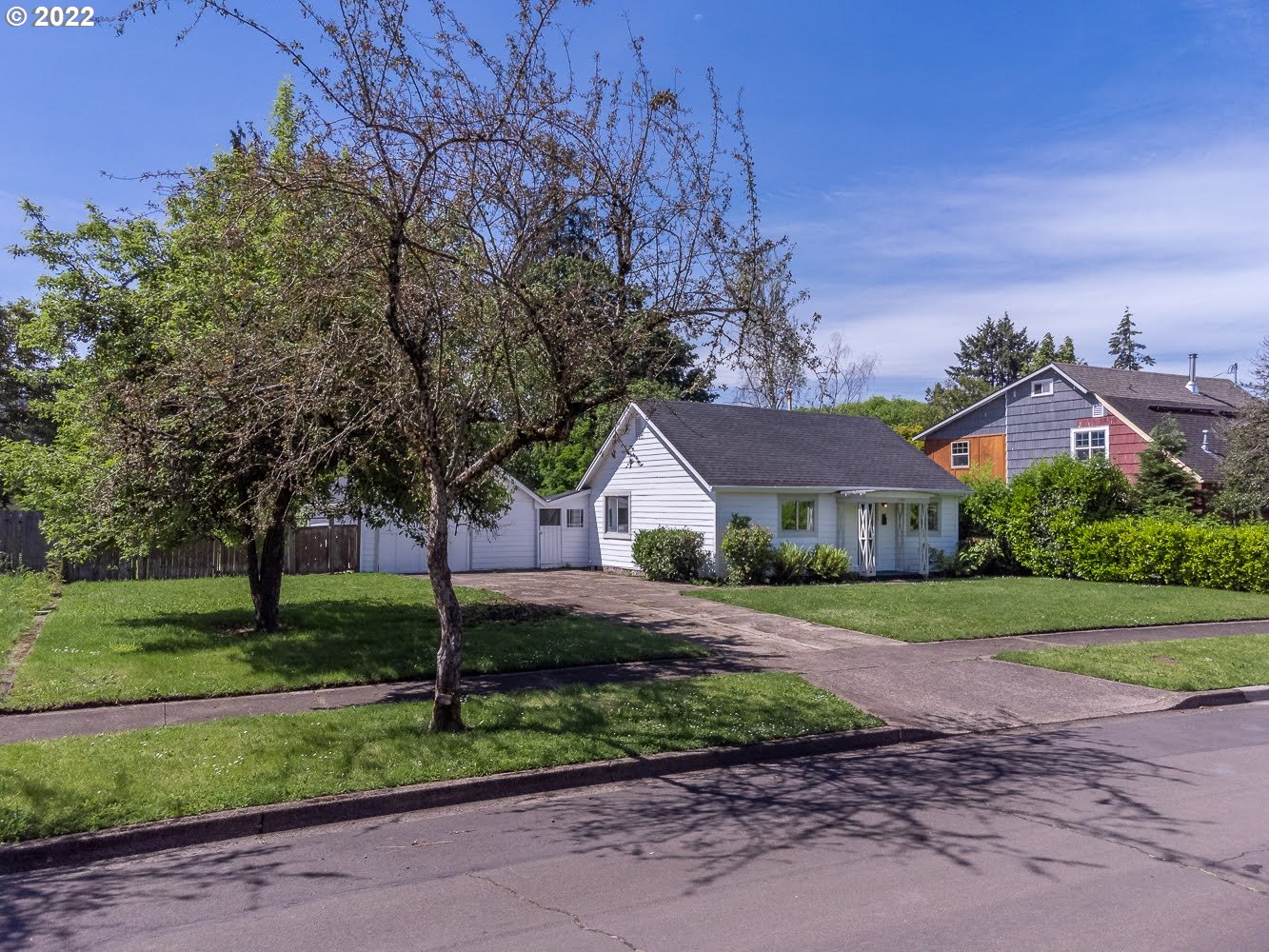 1147 F Street Springfield, OR 97477 - Photo 2 of 32 a front view of a house with a yard and garage