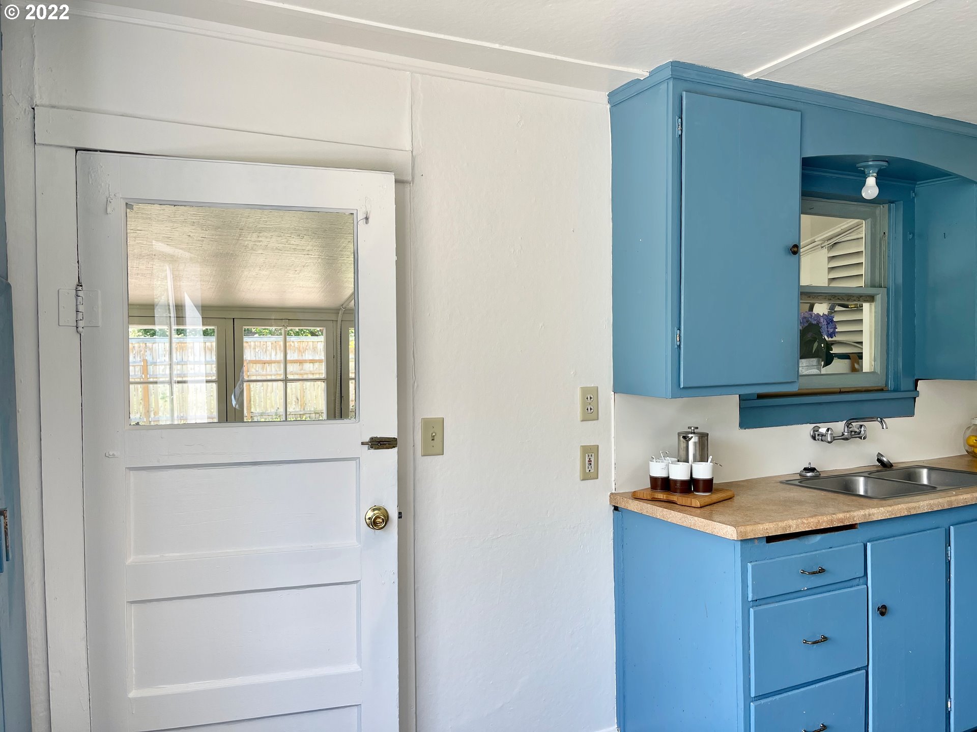 1147 F Street Springfield, OR 97477 - Photo 25 of 32 a kitchen with a refrigerator and a sink